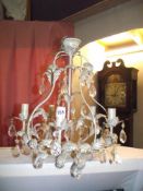 A Tole ware style metal chandelier light with glass droppers