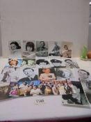 A quantity of photographs of mainly 'Carry on Stars' some with autographs.