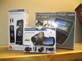 A 9" portable dvd player by Zennox, Silvercrest HD camcorder and multimedia speakers, all boxed