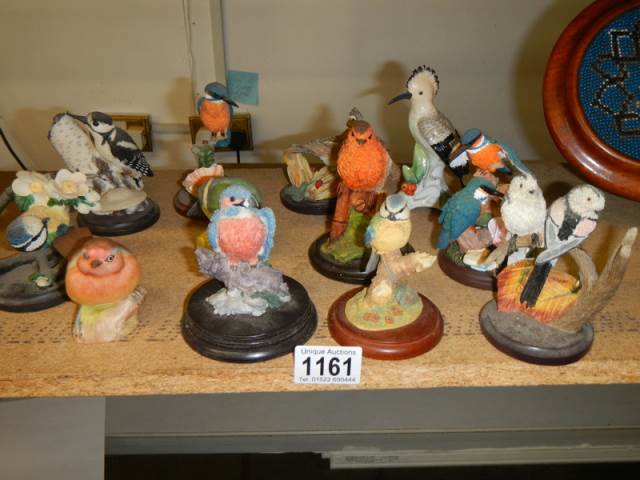 Twelve various bird figures.
