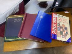 A quantity of stamp albums and files (most with stamps) and a Stanley Gibbons price guide