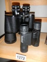 Two pairs of binoculars.