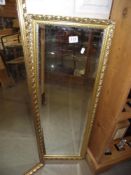A long gilt framed bevel edged mirror 97cm x 37cm COLLECT ONLY
