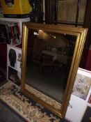 A large gilt framed mirror approx 80cm by 110cm COLLECT ONLY