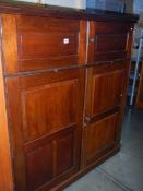 A Victorian mahogany four door butler's cupboard with two slides. COLLECT ONLY.