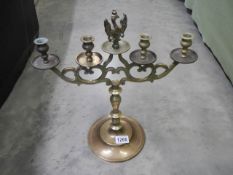 A solid brass candelabra with eagle on top. Possibly from a church.