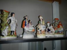 Five 19th century Staffordshire figures and spill vases, Poacher in good condition, others a/f.