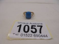A vintage ring set with a turquoise coloured stone, stamped 9ct with openwork shoulders, size K, 2.2