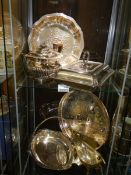A mixed lot of silver plate including gravy boat, trays etc.,