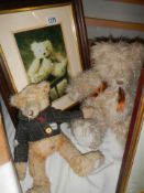 Two colllectable Teddy bears and a framed photograph of one of them.