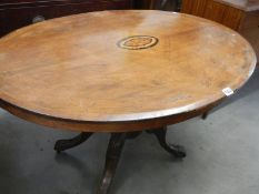An early 20th century oval mahogany inlaid tip-top table, COLLECT ONLY.