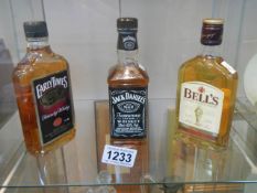 Three sealed bottles of whiskey - Bells, Jack Daniels and Early Days, COLLECT ONLY.