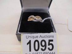 A 14k crossover gold ring, size Q, 2 grams.