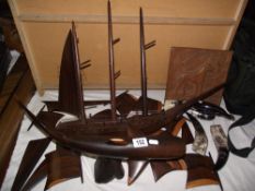 A hardwood carved model of a ship, wooden whale figure and horn bird figure, all a/f