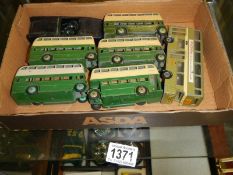 A quantity of Dinky buses and an early Airfix Austin Healey Sprite.