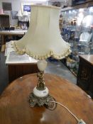 A table lamp with a cherub base.
