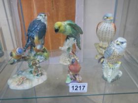 Six various bird figures including Beswick Parrot, Beswick Bird of Prey, Royal Worcester Chaffinch
