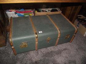 A large vintage wood bound travel trunk in very good conditon
