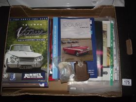 A quantity of car ephemera including badges, Triumph booklets etc