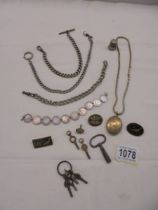 A mixed lot including watch chains, watch keys, coin bracelet etc.,