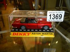 A boxed Dinky 110 Aston Martin DB5, in mint condition but box cracked.