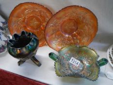 Four pieces of carnival glass including marigold.
