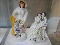 A tall 19C Staffordshire figure of a young woman a/f and another of a young couple.