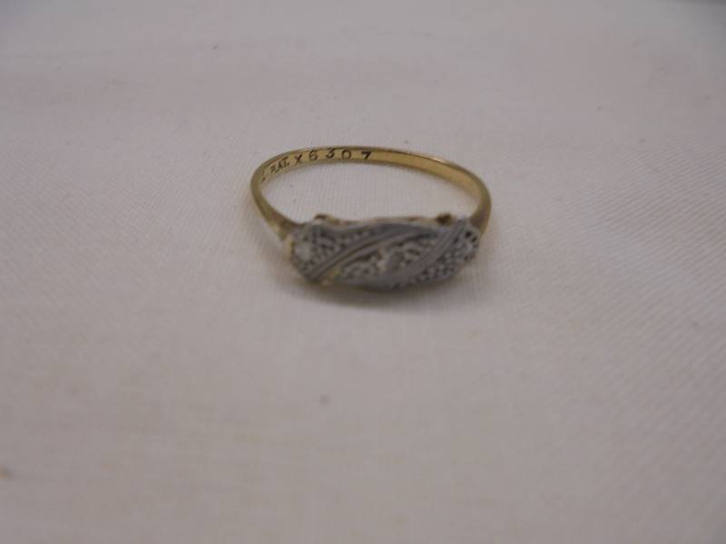 An art deco diamond three stone ring set in platinum and 18ct gold stamped, 1920/30, size N half, - Image 2 of 2