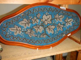 A late Victorian beaded tray in mahogany surround.