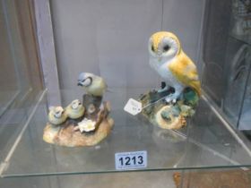 A Royal Crown Derby owl and a Royal Crown Derby blue tit with chicks.