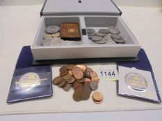 A box of assorted coins including Churchill crowns.