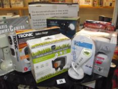 A misc lot of new items including ear and forehead thermometer, alarm system, solar lights etc