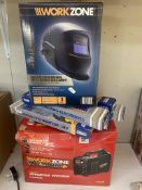 A boxed WorkZone Inverter Welder and a boxed WorkZone Auto Dimming Welding Helmet
