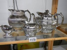 Four pieces of Ridgway silver lustre including teapot, cream jug, water jug and salt pot, circa