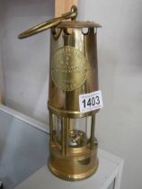 A good quality old brass miner's lamp.