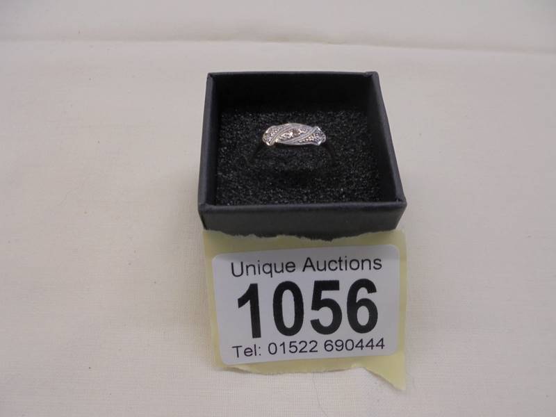 An art deco diamond three stone ring set in platinum and 18ct gold stamped, 1920/30, size N half,
