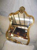 An ornate gilt framed mirror COLLECT ONLY