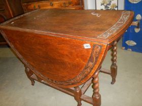 An oak barley twist gateleg table with carved border, COLLECT ONLY.