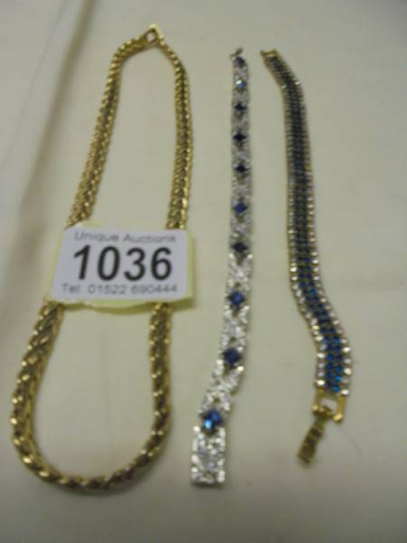 A silver gilt bracelet, a yellow metal necklace and two other bracelets. - Image 4 of 4