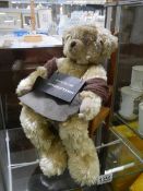 A teddy bear on a chair 'Grandads are Antique Little Boys'.