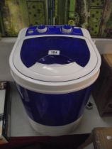 A Swiss Luxx portable washing machine