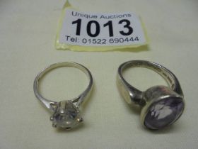 Two silver stone set rings, sizes N and O.