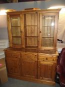 A solid pine kitchen dresser with glazed doors COLLECT ONLY
