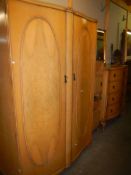 A circa 1960's bedroom suite comprising wardrobe, four drawer chest and pair of bedsides,