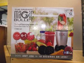 A boxed original Magic Bullet food processing system