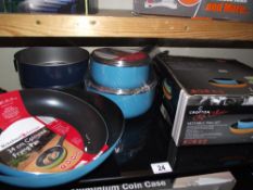 A set of 2 new saucepans, frying pan, wok, 2 baing tins and a nestable pan set