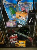 Two shelves of boxed diecast models including Thunderbirds, Tin Wizard, Vanguards etc.,