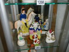 Six 19th century Staffordshire figures including horse with rider, archer etc. (the 2 small one