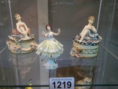 A Dresden ballerina and two ballerina trinket boxes.