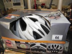 A Crivit cycle helmet L/Xl 59cm to 65cm and 2 bicycle floor pumps